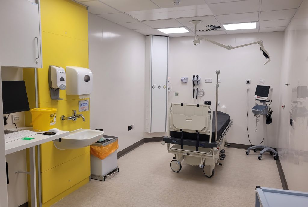 New cubicle in the Emergency Department with bed, equipment and was basin