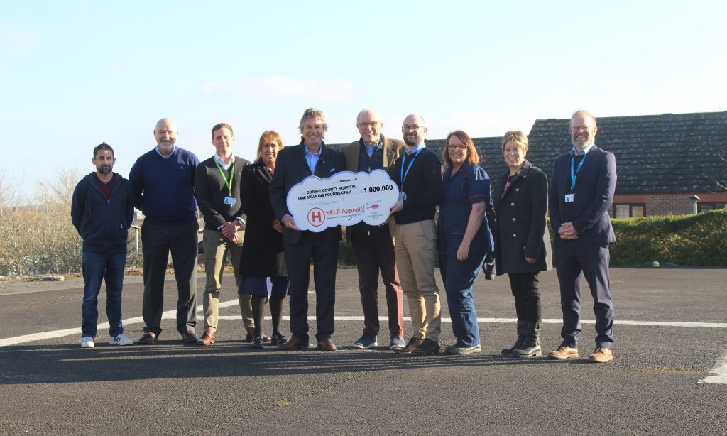 HELP Appeal pledge photo DCH staff and HELP Appeal representatives with a giant cheque